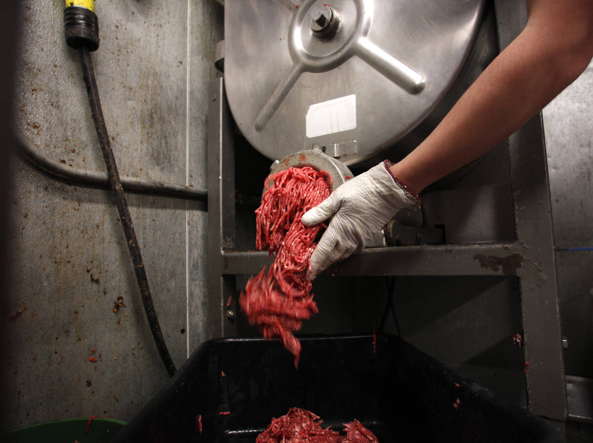 Butcher Brett Marley holds freshly ground beef at Casey's Market in Western Springs, Illinois, April 25, 2012.
