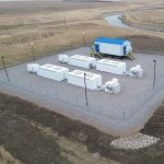 An aerial view of the battery energy storage system (BESS), part of the enhanced Battery and Renewables (eBAR) project near Raymond, Alberta.