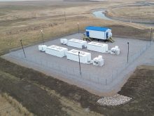 An aerial view of the battery energy storage system (BESS), part of the enhanced Battery and Renewables (eBAR) project near Raymond, Alberta.