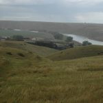 A farm along the Oldman River north of Tempest, Alta., is seen from the hills above on a cloudy day.