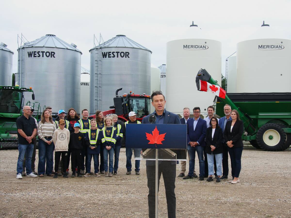 Pierre Poilievre at Sixteen Grains farm near Saskatoon, Sask with Sixteen Grains family to the left and local MPs to the right. 