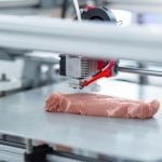 A stock image of a piece of "meat" being created by a 3-D printer.