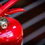 Fire extinguisher detail. Ilbusca/iStock/Getty Images