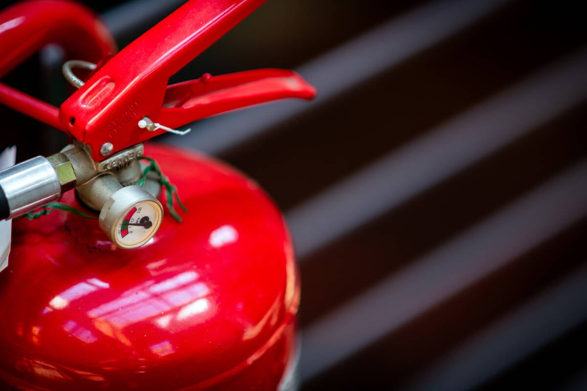 Fire extinguisher detail. Ilbusca/iStock/Getty Images