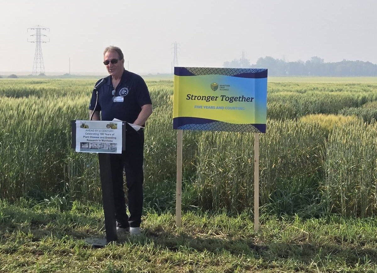 Manitoba Agriculture Minister Ron Kostyshyn speaks at a 100-year celebration for Manitoba’s crop breeding and disease research on Aug. 7, 2025. Photo: Miranda Leybourne