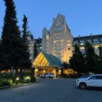 The grand entrance of the Fairmont Chateau Hotel in Whistler, B.C., at dusk.