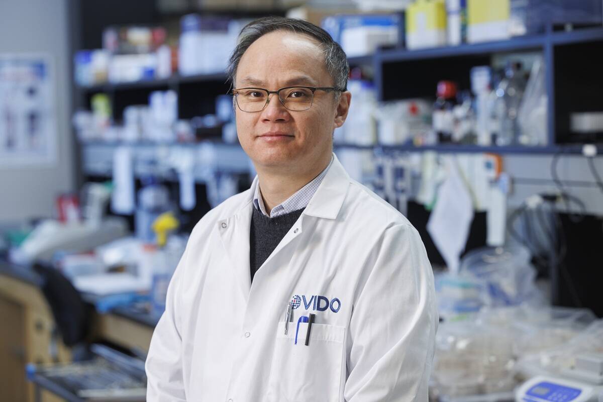 A scientist in a white lab coat with