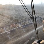 The view from the cab of a combine as a wheat crop is straight cut near Binscarth, Manitoba on September 25, 2025.