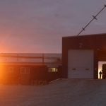Alberta sunrise as farmers deliver early morning samples to the Agricore United highthroughput elevator near Indus.