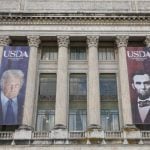 Banners of U.S. President Donald Trump and President Abraham Lincoln reading “Growing America Since 1862” hang over the entrance to the United States Department of Agriculture (USDA) in Washington, D.C., U.S., May 15, 2025. Photo: REUTERS/Kevin Lamarque/File Photo