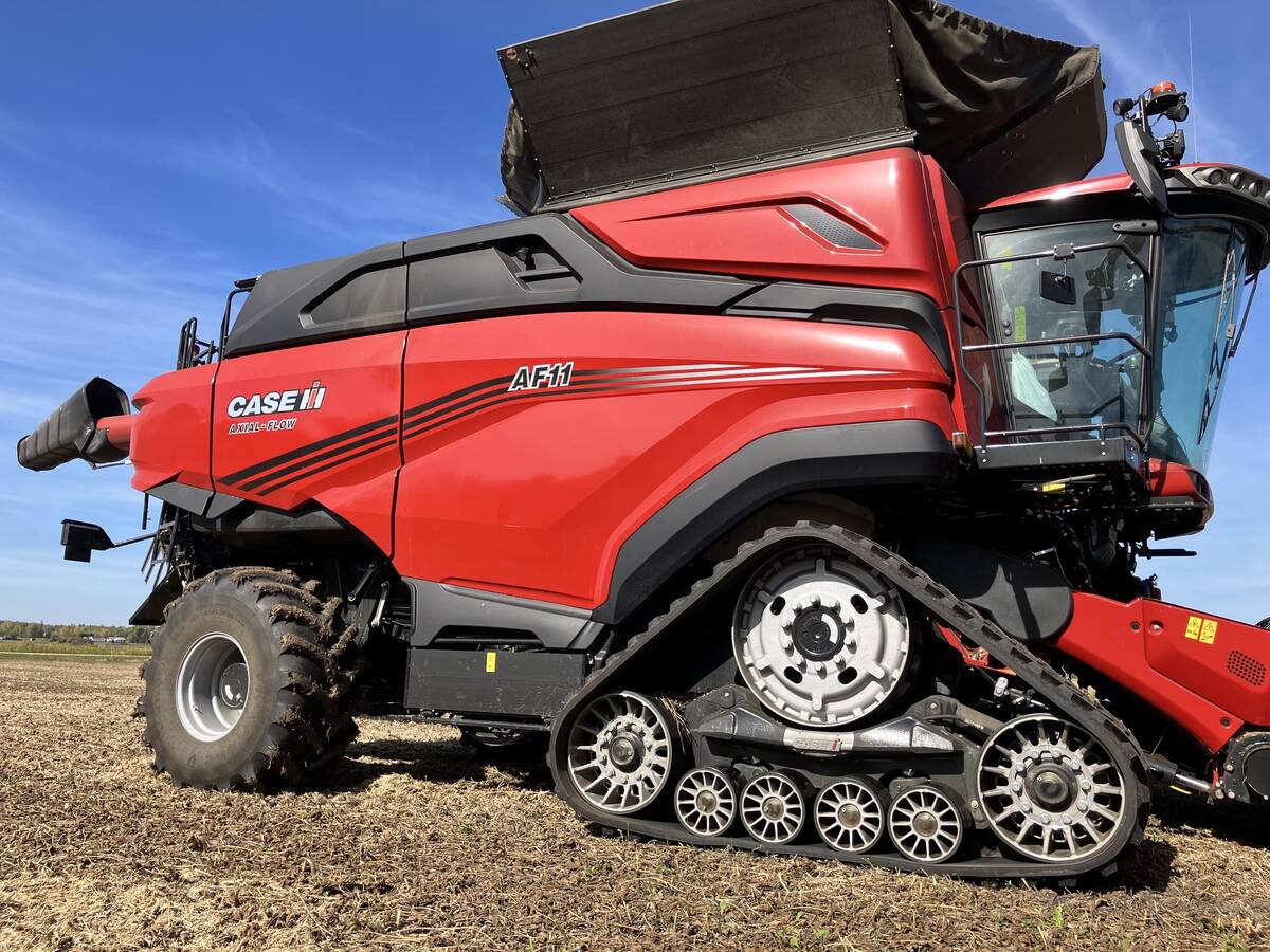 A side view of Case IH's new AF11 combine showing the machine's front end tracks.