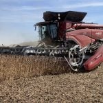 The New Agco AF11 combine at work on a field of soybeans.