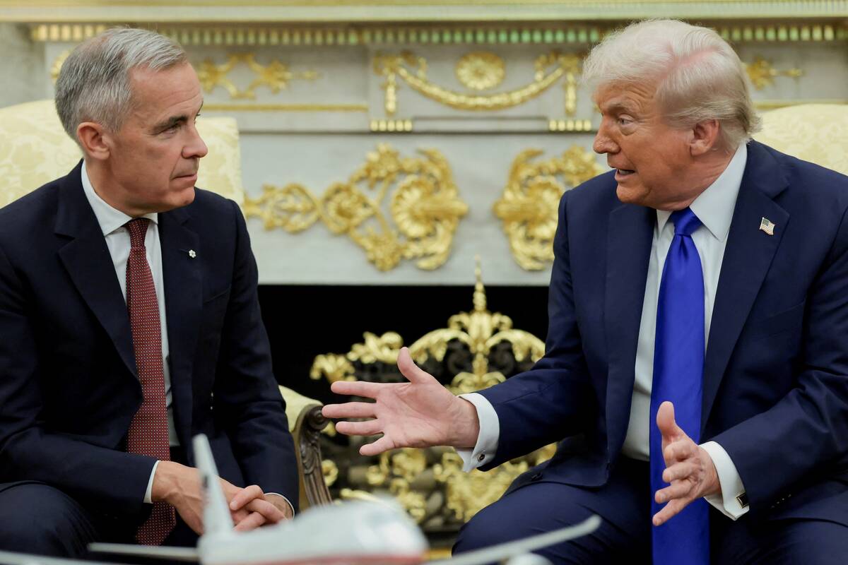 U.S. President Donald Trump and Canada's Prime Minister Mark Carney meet in the Oval Office at the White House in Washington, D.C., on October 7, 2025.