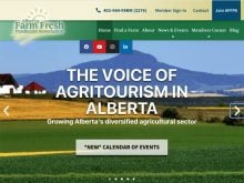 A screencap from the homepage of the Alberta Farm Fresh Producers Association showing a rural setting in the summer with the foothills in the background and the words, "The Voice of Agritourism in Alberta" written overtop the image.