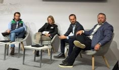 Nick Paterson, left, from Australia, moderator Anna Catharina Voges, Maxim Bozhko of Kazakhstan and Jason Friesen of Canada were on a panel of large farms at Agritechnica.