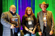 (From left to right) Lawrence Knockaert and Shauna Breault are inducted onto the Manitoba Forage and Grassland Association wall of fame Nov. 12 by MFGA chair Mike Duguid.