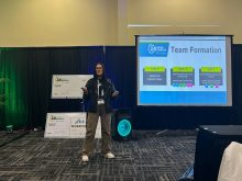 Bri Blazeiko stands beside a projector screen displaying, "Team Formation" information at the start of the 24-hour Startup held during Agribition in November, 2025.