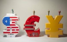 Models of US dollar sign, Euro sign and China's RMB sign.