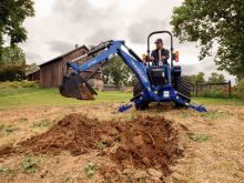 New Holland&rsquo;s latest Workmaster compact tractor equipped with the 270BC backhoe.  Photo: New Holland