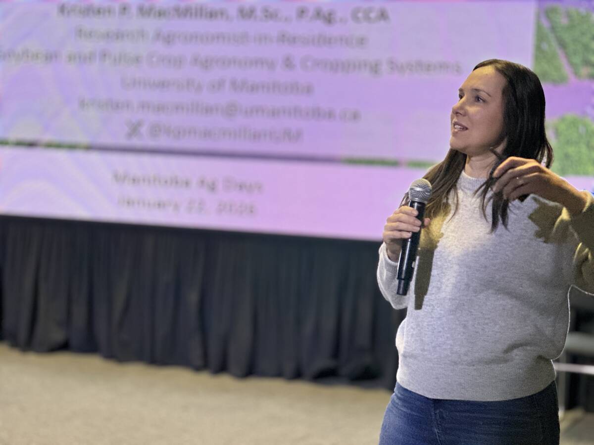 University of Manitoba researcher Kristen MacMillan presents research on soybean rolling timing during AgDays in Brandon, outlining how crop stage affects plant damage and yield risk. Photo: Don Norman