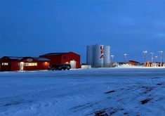 A photo of a United Farmers of Alberta (UFA) store at dusk in the winter.