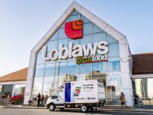 The mostly glass entry of a "Loblaws" grocery store.