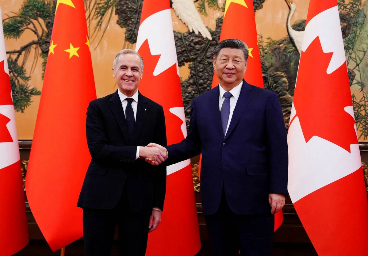 Canadian Prime Minister Mark Carney shakes hands with Chinese President Xi Jinping in front of a background of Chinese and Canadian flags.
