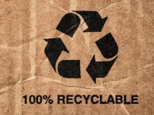 A 100% Recyclable message below a large recycling symbol on cardboard packaging.