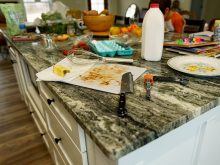 A kitchen island with the mess left following meal preparation left untouched.