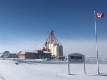 A screencap of the Richardson International facility near Delsile, Saskatchewan, in winter with a clear blue sky overhead.