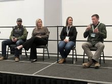 Two men and two women, all specialty crop growers, sit on chairs on a stage talking about the challenges of planning long-term crop rotations of niche crops at the Irrigated Crop Production Update in Lethbridge, Alta., in 2026.