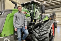 Eric Bossuyt, an account manager with AgWest in Russell, Man., on the steps of a Fendt Vario tractor connected to a Fendt Momentum planter at the dealership in Elie.  Photo: Greg Berg