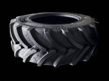 A promotional photo of a new agricultural tire set against a black background.