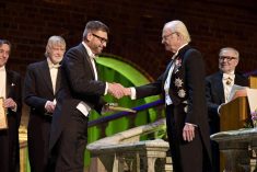 Curtis Pozniak, left, receives the Bertebos Prize from King Carl XVI Gustaf of Sweden at a ceremony in Stockholm, Sweden. Photo: Erik Cronberg