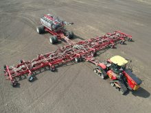An overhead drone photo of the new Morris Quantum 100 foot air seeder paired with a Morris 10 Series 1440 bushel air cart.
