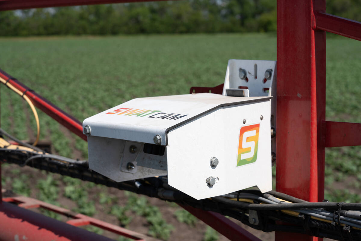 A close-up of a SWAT Cam unit mounted on a sprayer boom. The system uses machine learning to analyze images and generate crop and weed maps. Photo: Croptimistic
