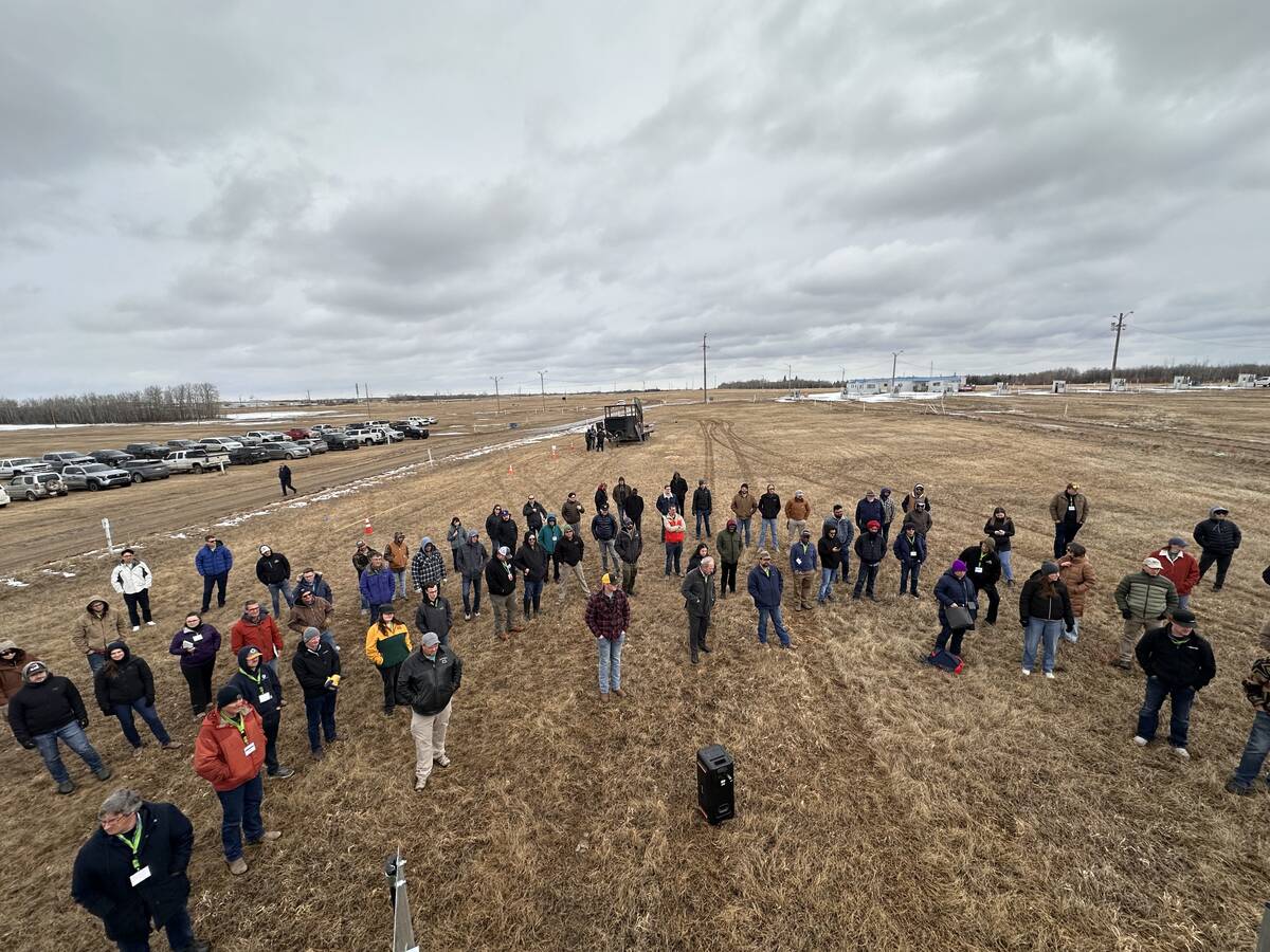 Looking down at a group of farmers at a drone conference.