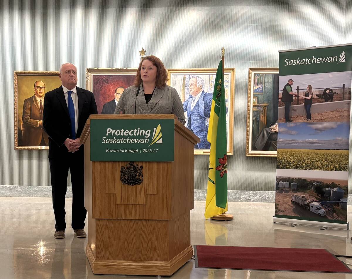 Saskatchewan agriculture minister David Marit and Farm Land Security Board general manager Kim McLean at a news conference announcing a legislative review
