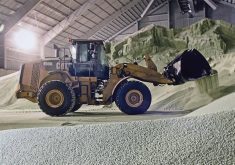 A wheel loader at work moving fertilizer inside a facility at the Southwest Terminal near Gull Lake, Saskatchewan.